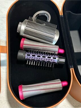 Dyson tan storage case and curling barrels